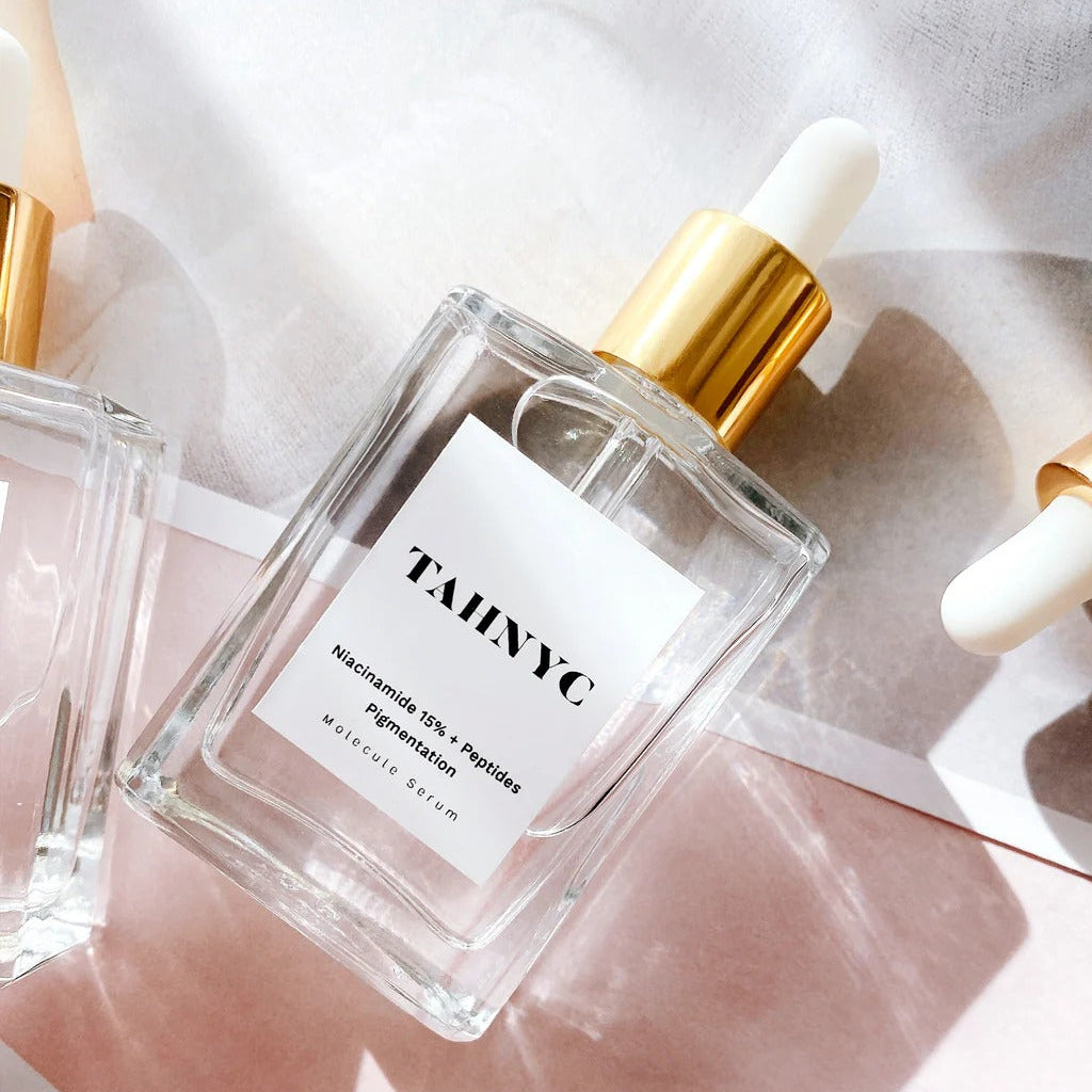 TAHNYC Niacinamide 15% + Peptides for Pigmentation Serum flatlay on blush background – The Pharmacy Lab