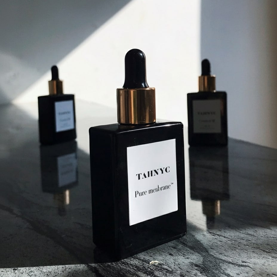 TAHNYC Pure Membrane skin hydration serum styled beside faucet and watch – The Pharmacy Lab