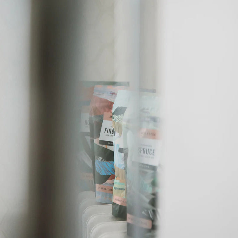 Magazines stacked against a white wall