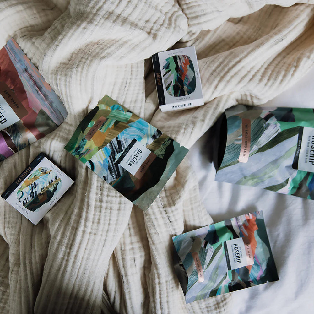 Colorful packages with labels on a textured fabric surface