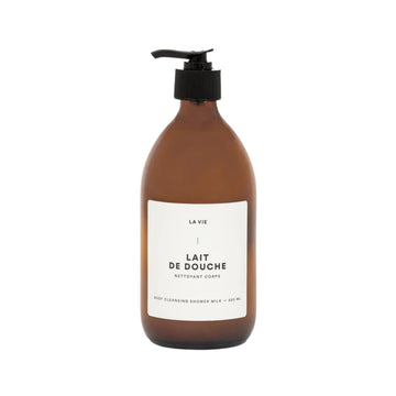 Brown bottle of 'Lait de Douche' with a pump on a white background