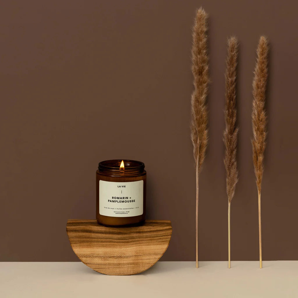 Candle jar with a label on a white background