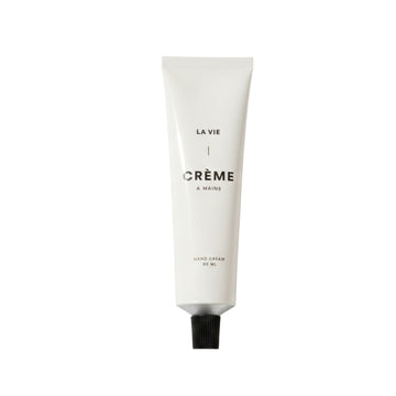 Hand cream tube labeled 'La Vie Crème' on a white background