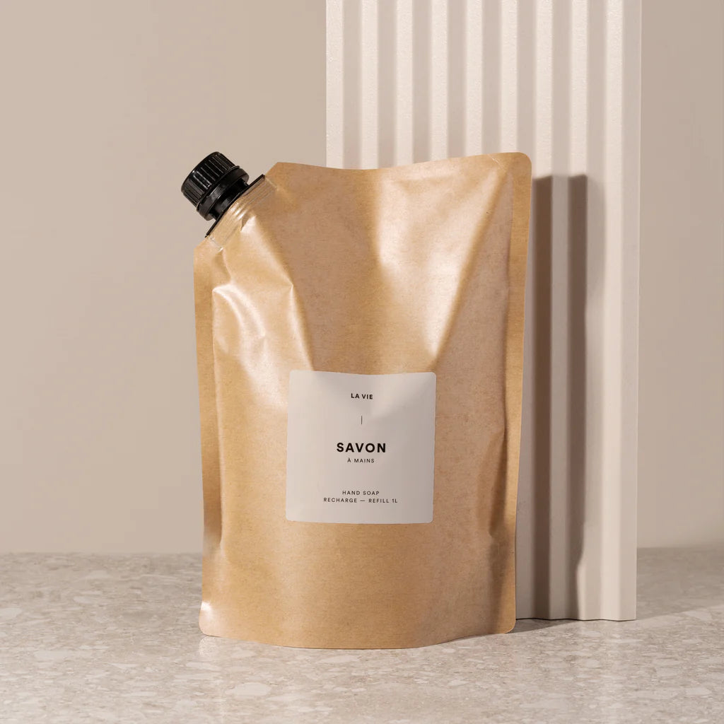 Beige soap packaging with a label on a neutral background