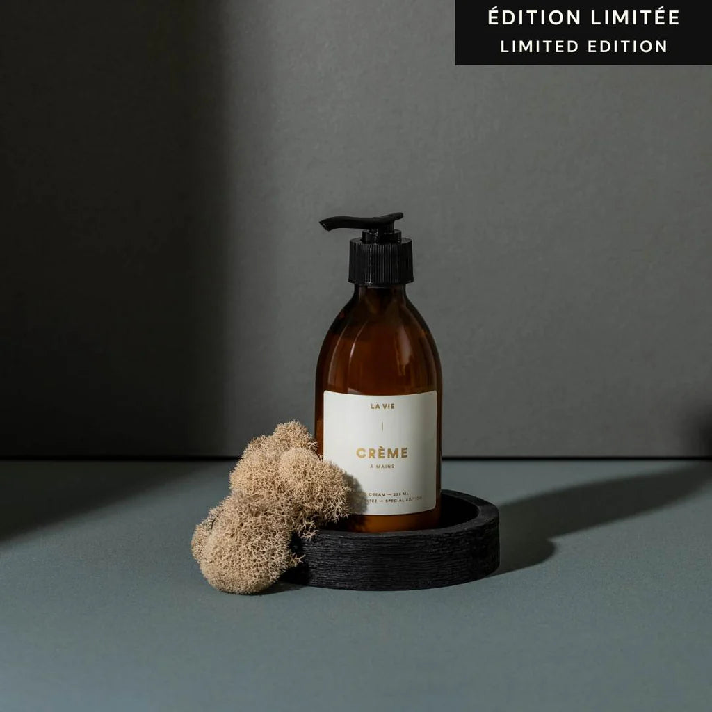 Atelier La Vie Apothicaire limited edition hand cream displayed in an amber bottle with natural styling elements
