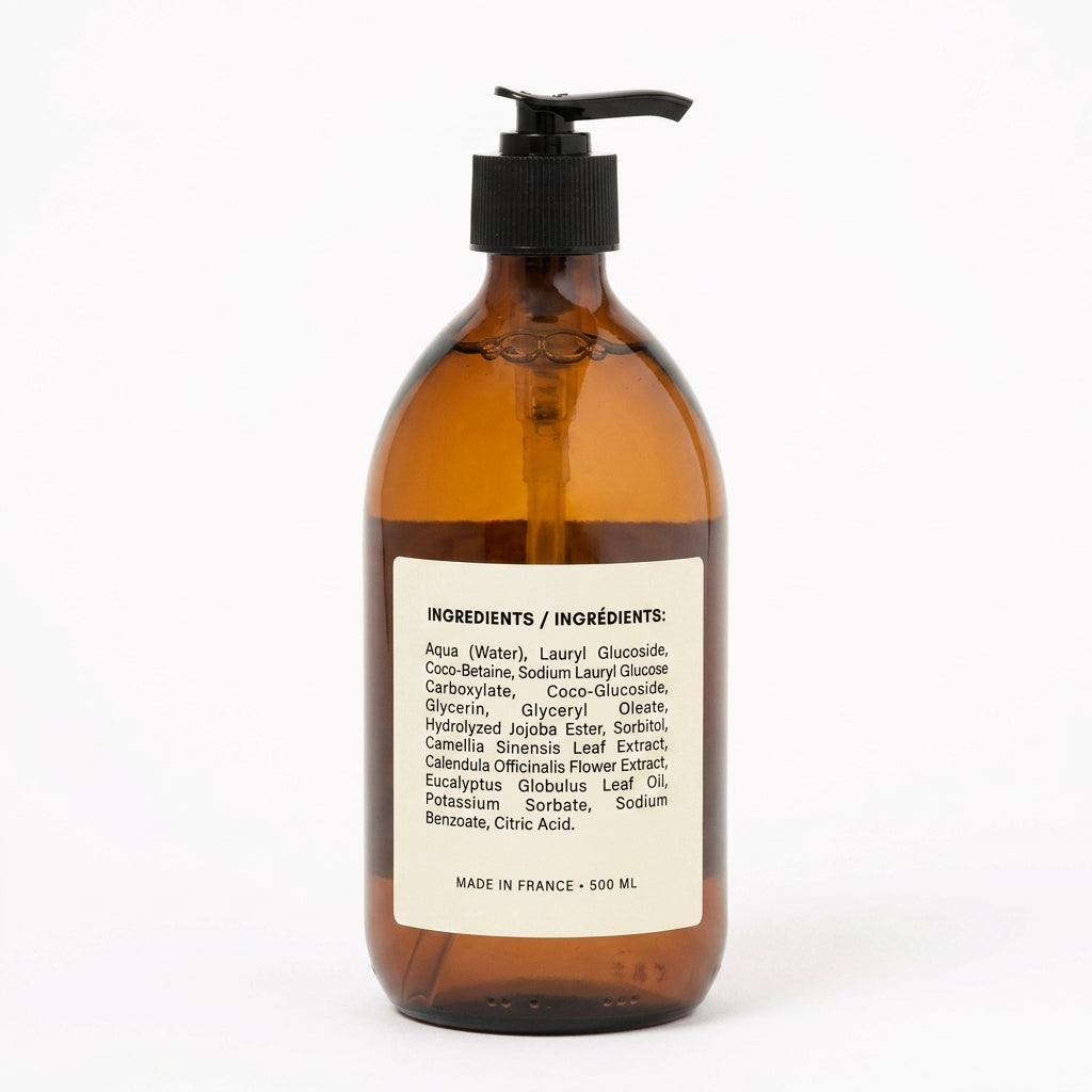 Amber glass bottle with pump and 'La Vie' label on a white background
