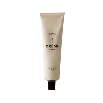 Hand cream tube labeled 'La Vie Crème   Mains' on a white background