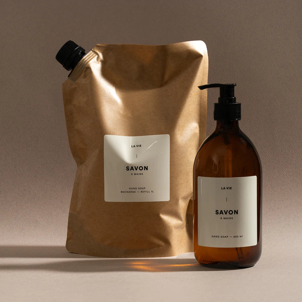 Beige soap refill pouch with a label on a white background