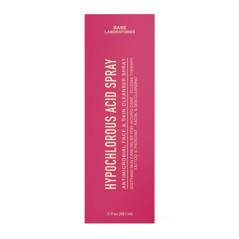 A tall, narrow pink box for Base Laboratories Hypochlorous Acid Spray, featuring white text on a clean white background.