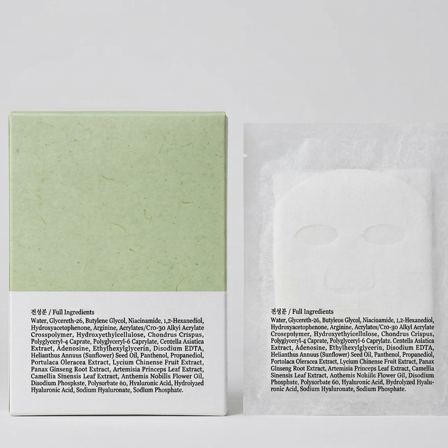 A skincare product set featuring a light green rectangular box with white text on the bottom half, next to a clear resealable pouch containing a white cream, photographed on a light gray background.