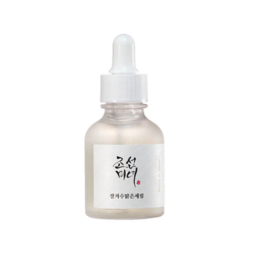 Skincare serum bottle with dropper on a white background