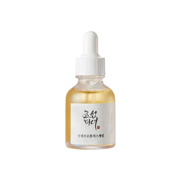 Skincare serum bottle with dropper on a white background