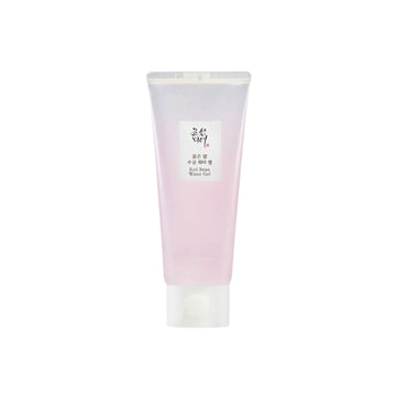 Pink and white tube of skincare product on a white background