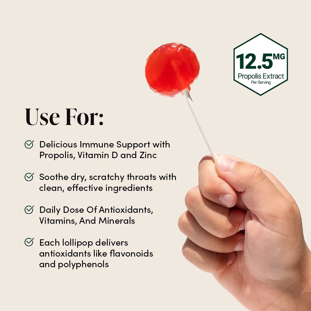 Red lollipop held by a hand with health benefits text on a beige background