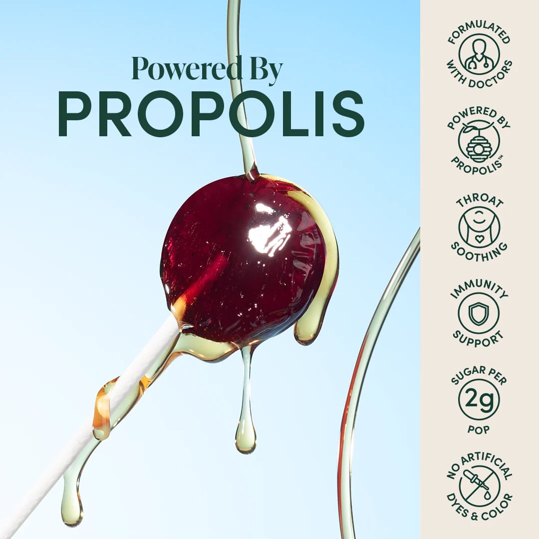 Product packaging with propolis text and cherry illustration on a blue background