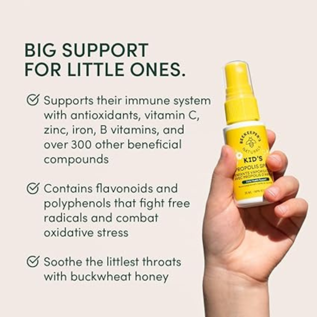 Hand holding a yellow bottle with text about its benefits for children's health on a beige background