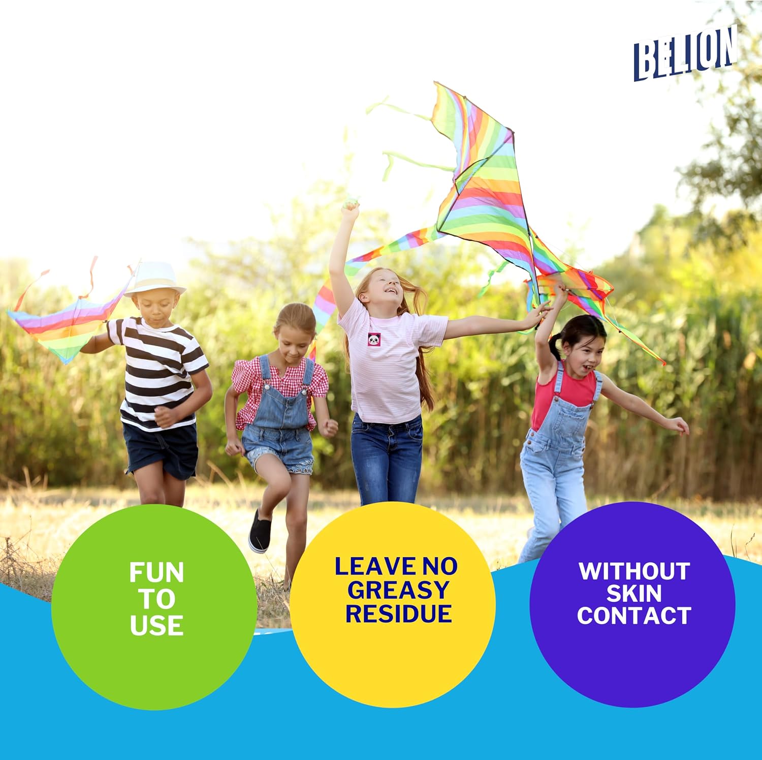 Four children running outdoors while flying colorful rainbow kites in a sunny field. Three circular callout graphics at the bottom read 'FUN TO USE', 'LEAVE NO GREASY RESIDUE', and 'WITHOUT SKIN CONTACT', and the brand name BELION appears in the top right.