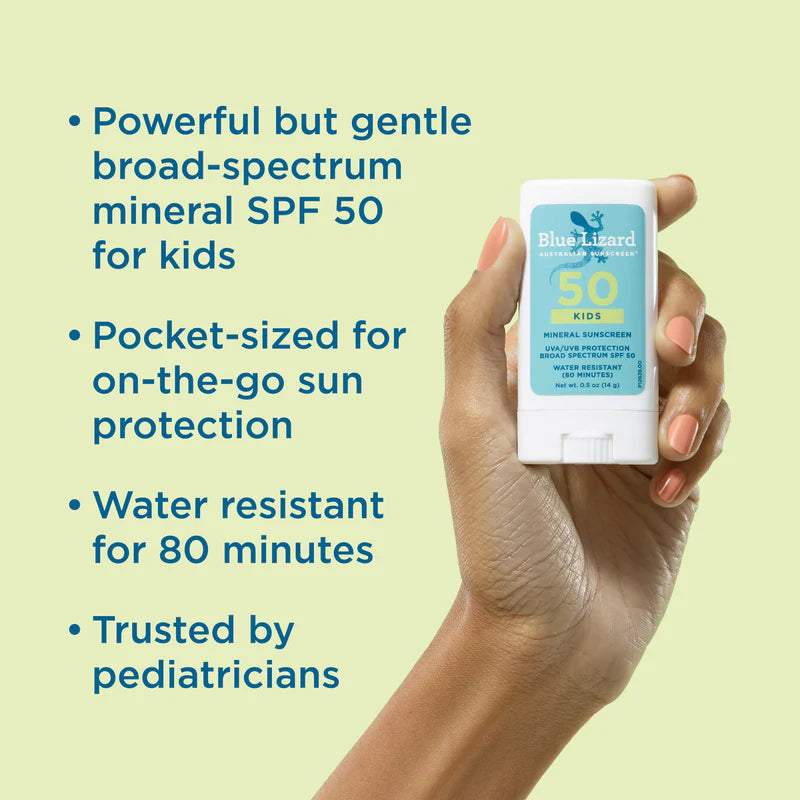 Hand holding a Blue Lizard sunscreen stick with product details on a light green background