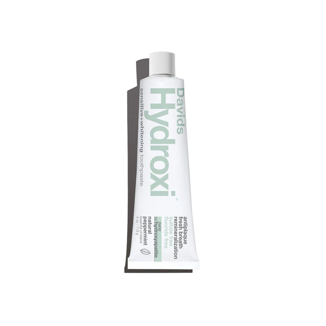 A squeeze tube of Davids Hydroxi toothpaste on a plain white background.