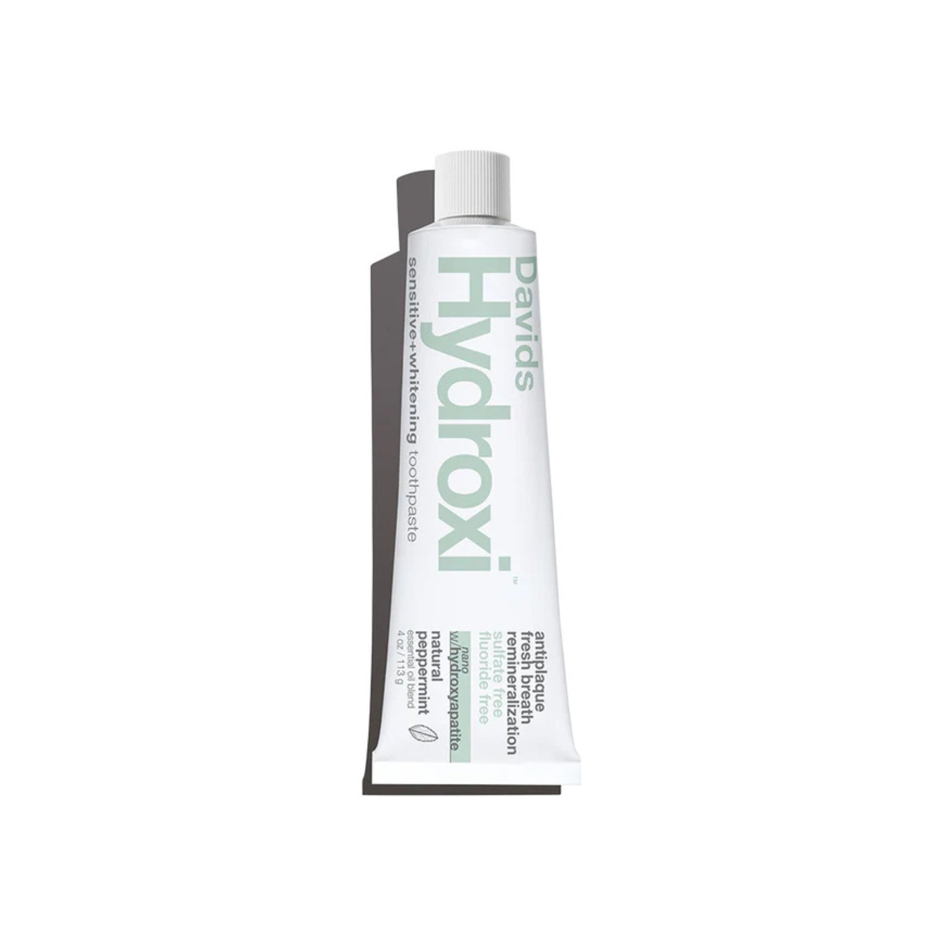 A squeeze tube of Davids Hydroxi toothpaste on a plain white background.