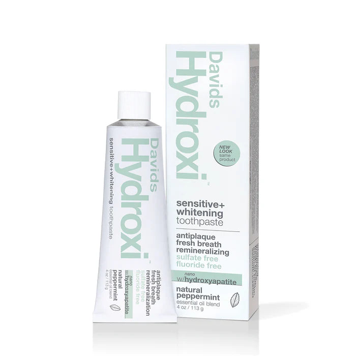 A squeeze tube of Davids Hydroxi toothpaste on a plain white background.