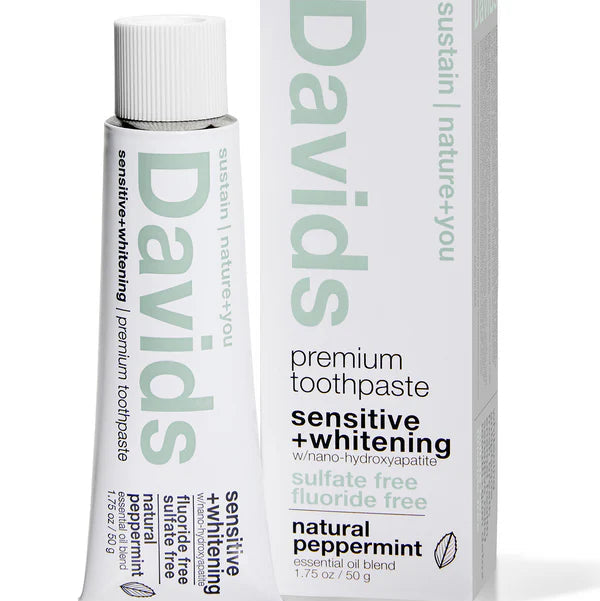 A tube and box of Davids Sensitive+ Whitening natural peppermint toothpaste on a clean white background.
