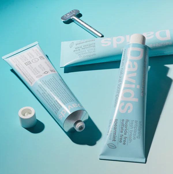 DAVIDS skincare products on a blue background