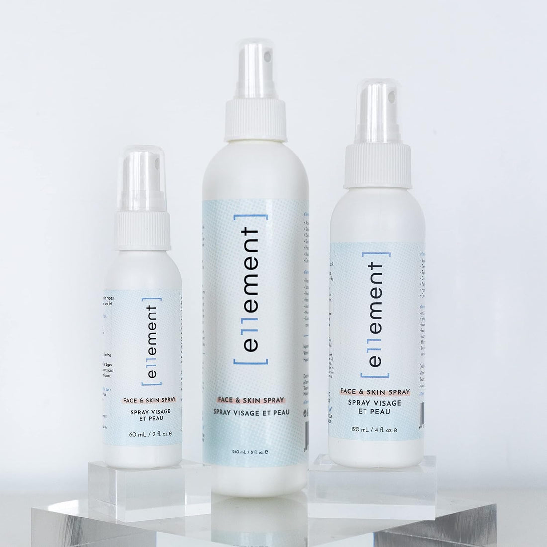 A white spray bottle of ellement Reinvigorating Air Hair & Skin Spray with a white cap, shown on a plain white background.