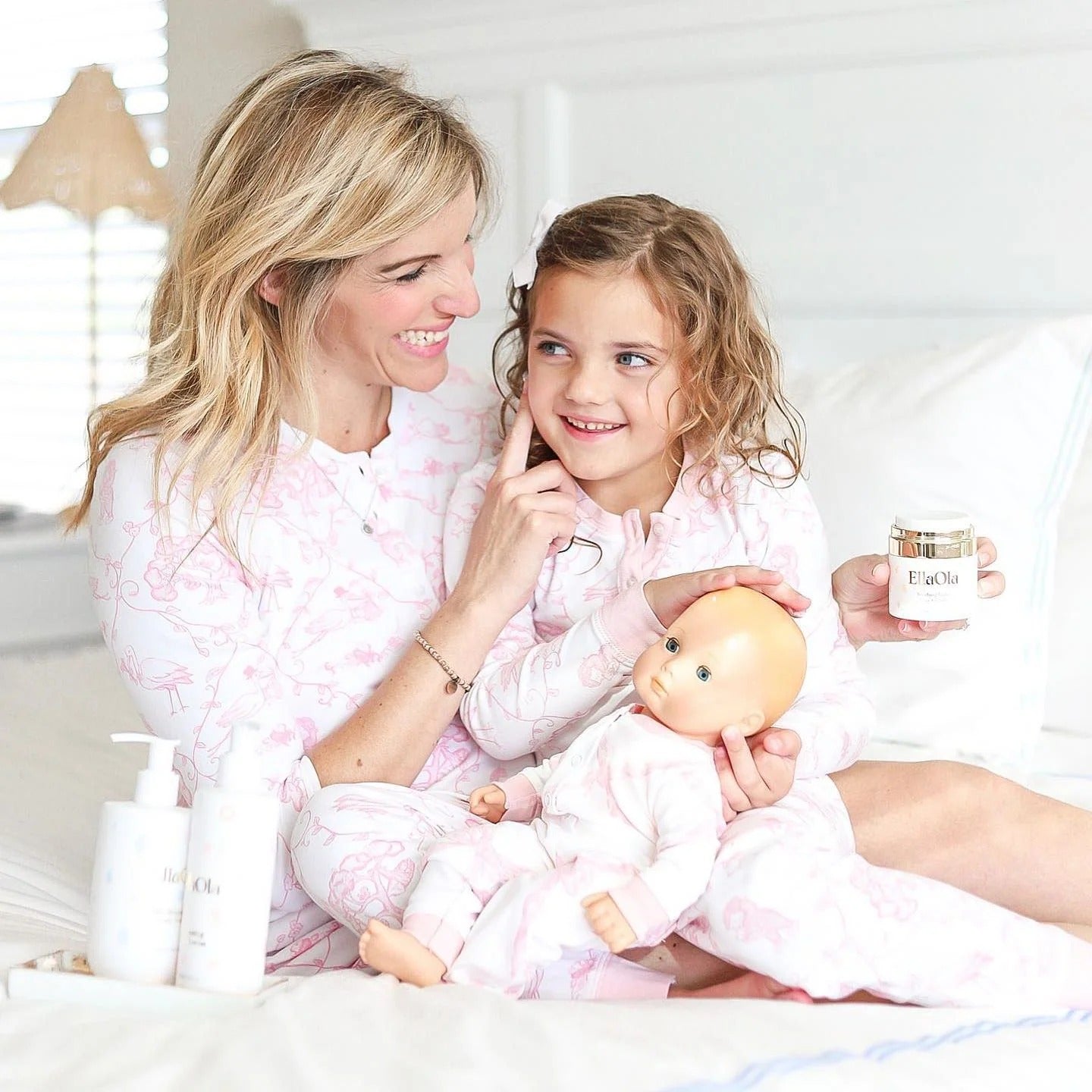 Mother and daughter applying EllaOla Moisturizing Baby Face Cream during their skincare routine, showcasing gentle, dermatologist-approved baby hydration.