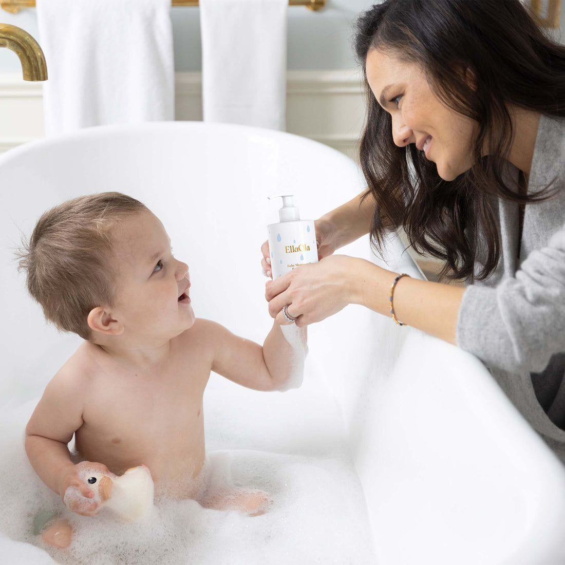 Ella Ola baby shampoo and body wash bottle on a white background