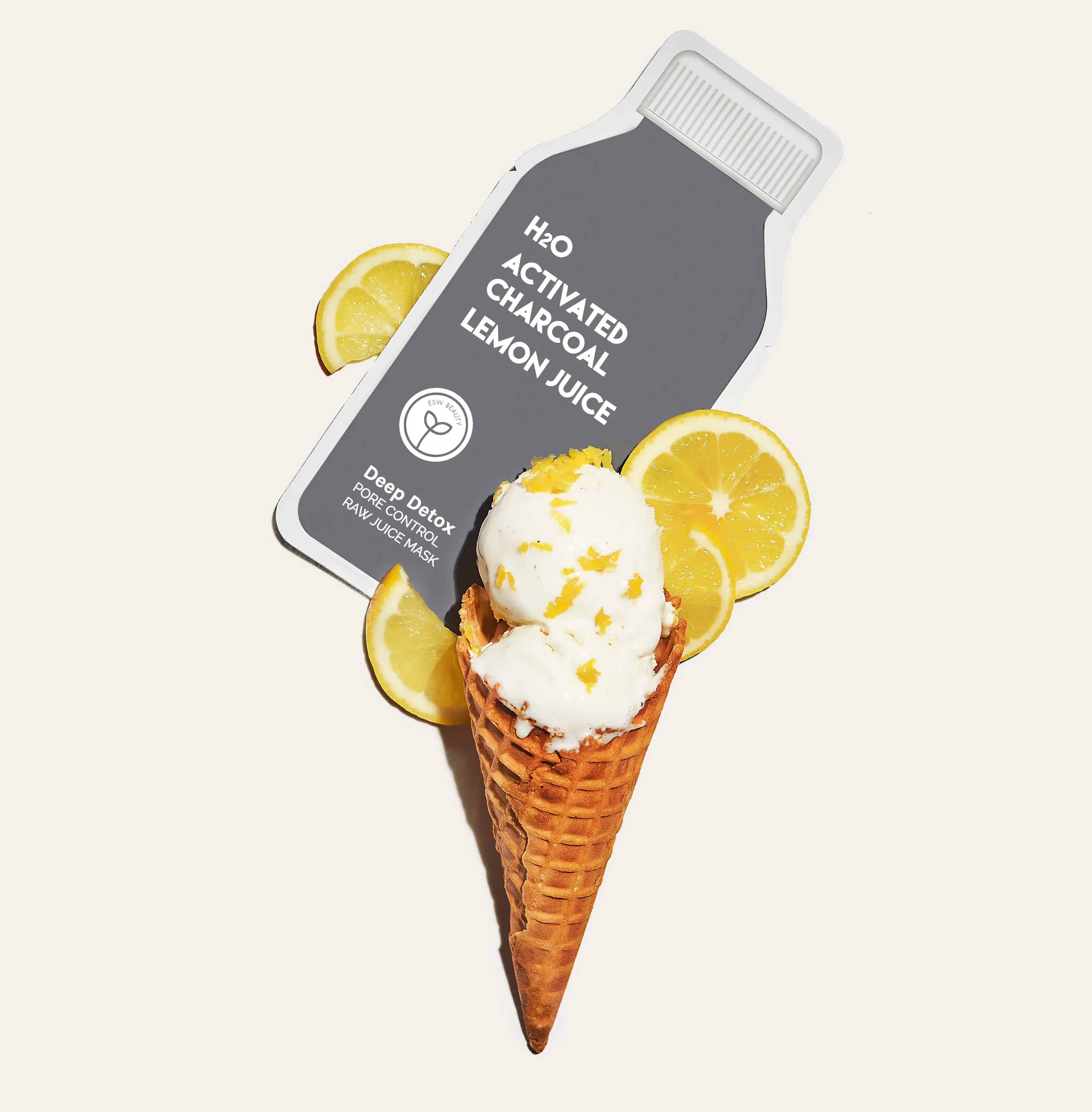 Product packaging labeled 'H2O Activated Charcoal Lemon Juice' with a cone of ice cream and lemon slices on a light background.