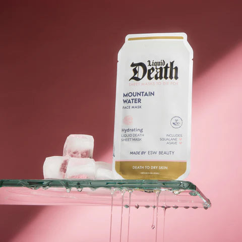 Liquid Death mountain water face mask packaging with sheet masks on a pink background