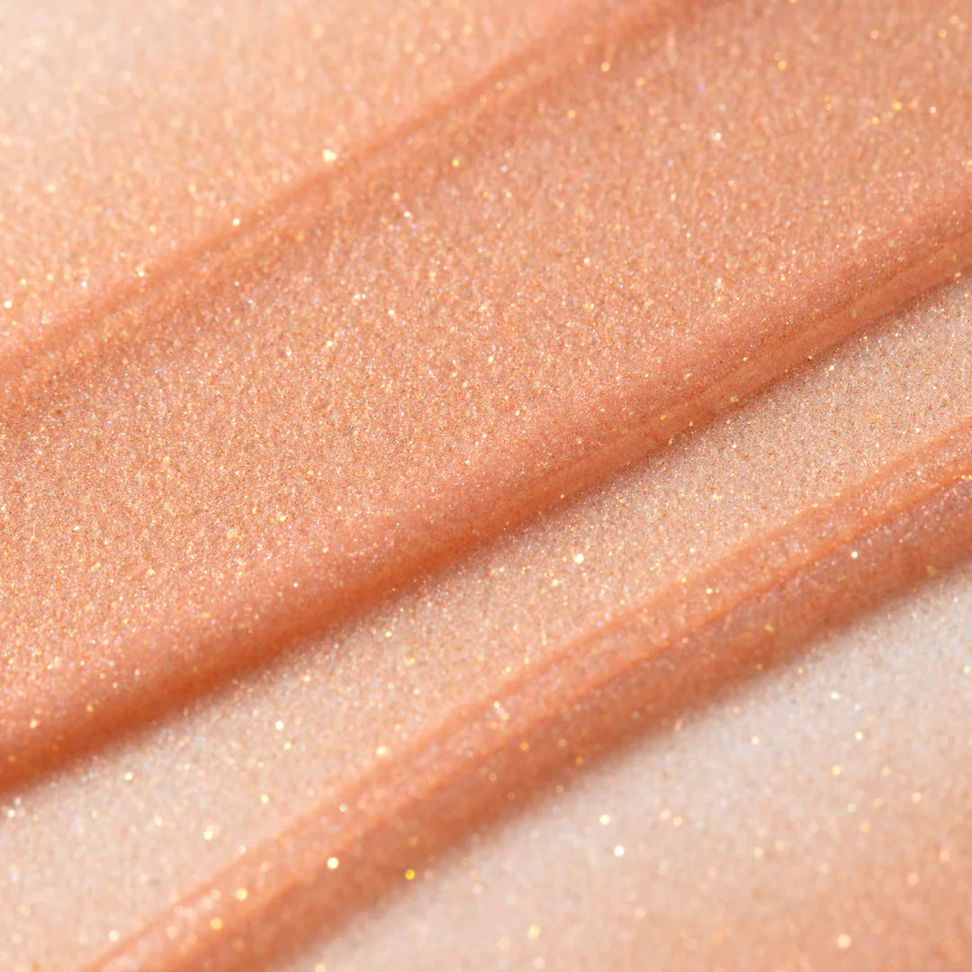 Macro texture of ESW Beauty Rose Sugar Enhanced Protection Smoothie Lip Treatment, revealing subtle shimmer and moisturizing formula available at The Pharmacy Lab.