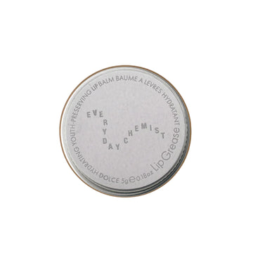 Lip balm container with 'Every Day Chemist' branding on a white background