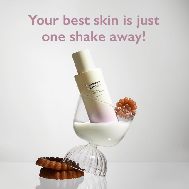 Skincare product with a glass of milk and cookies on a white background with text 'Your best skin is just one shake away!'.