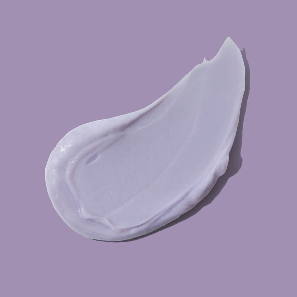 White cream swatch on a purple background