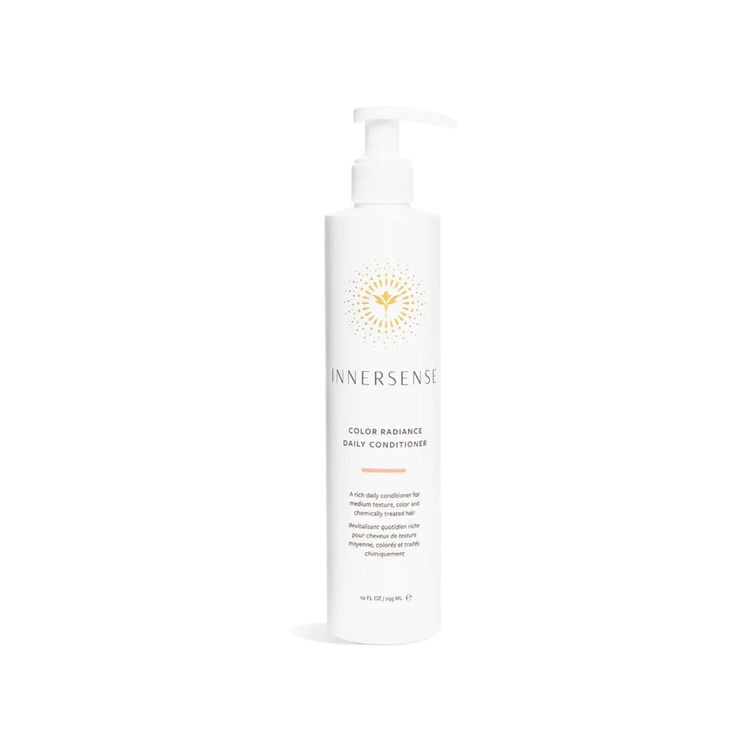 A tall white pump bottle of Innersense Color Radiance Daily Conditioner with a gold sunburst logo, centered on a clean white background.