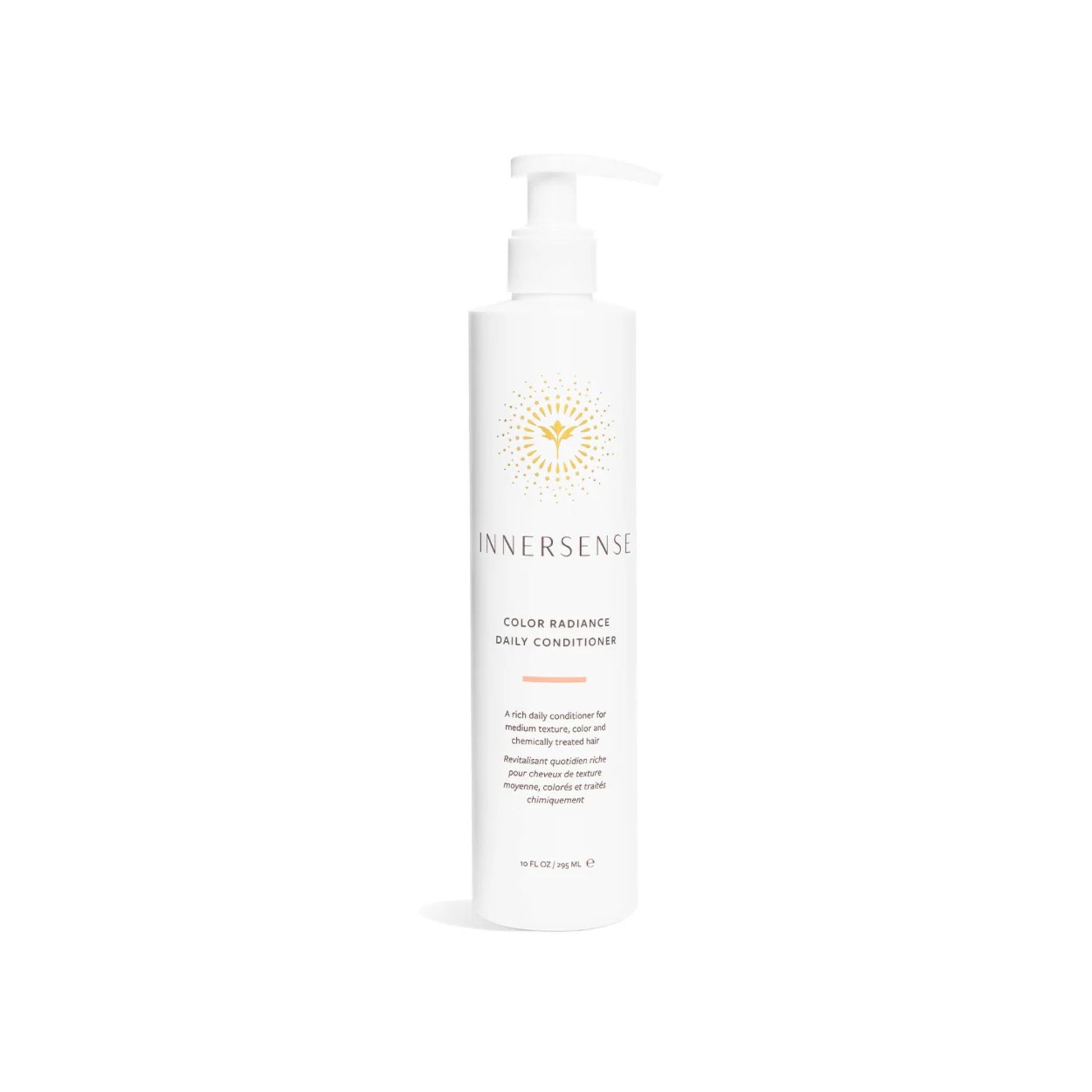 A tall white pump bottle of Innersense Color Radiance Daily Conditioner with a gold sunburst logo, centered on a clean white background.