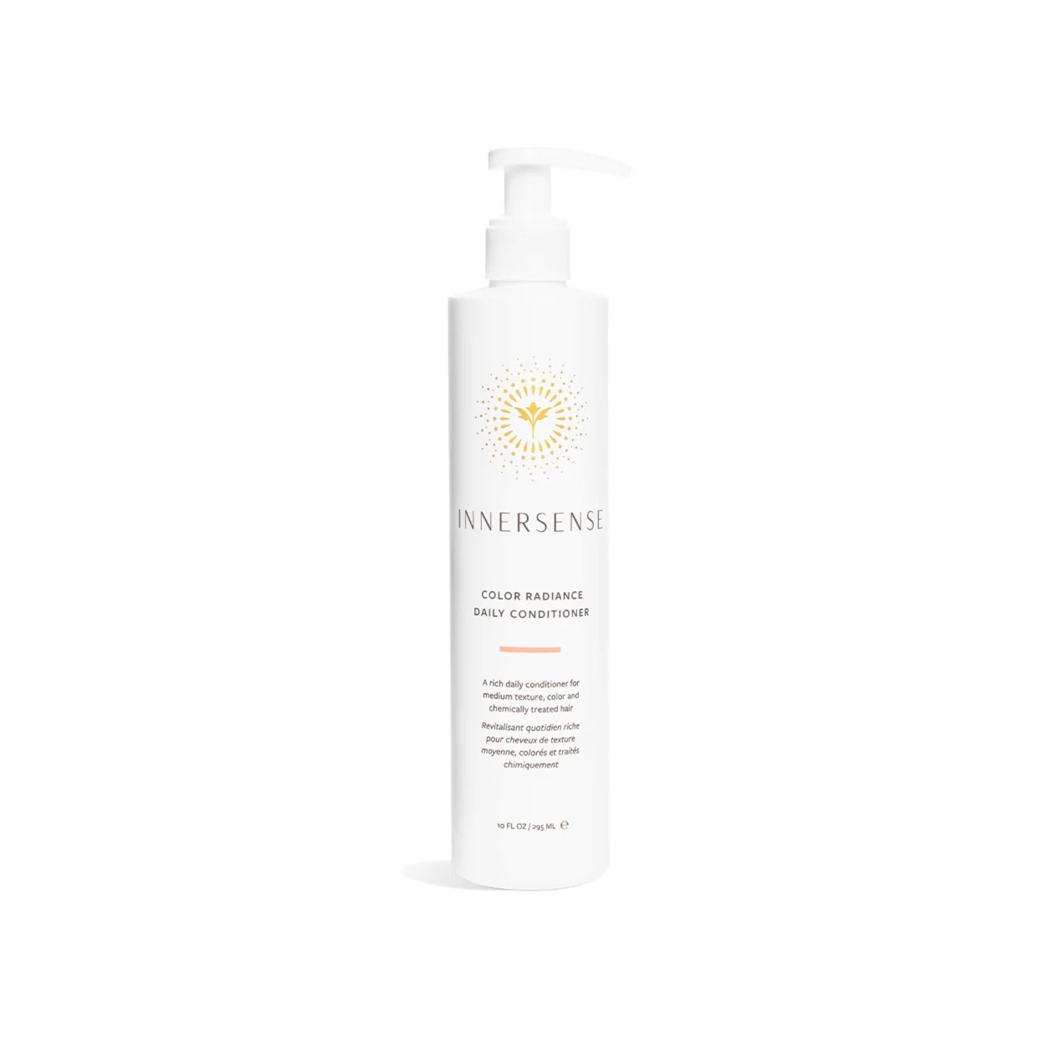 A tall white pump bottle of Innersense Color Radiance Daily Conditioner with a gold sunburst logo, centered on a clean white background.