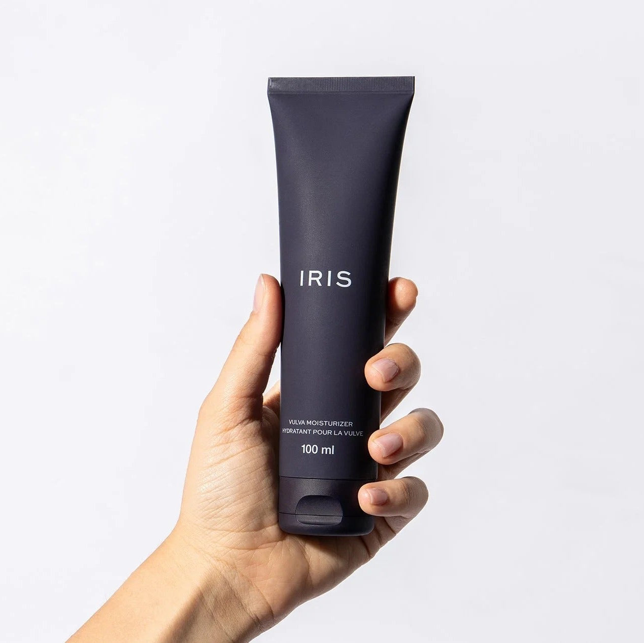 Hand holding The Pharmacy Lab IRIS Vaginal Moisturizer 100 mL lightweight vulva moisturizer for long-lasting hydration and comfort