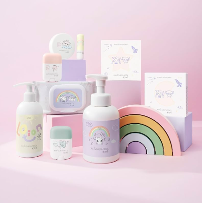 Children's skincare product set with pastel colors on a pink background