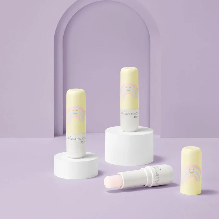 Set of skincare products with rainbow designs on a light purple background