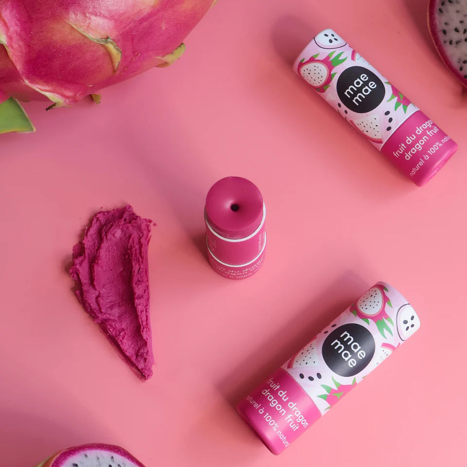 Pink lip balm with dragon fruit flavor on a pink background