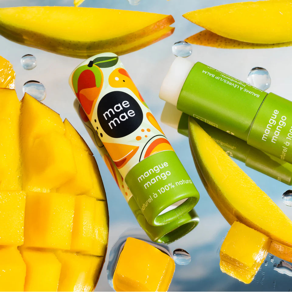 Mango-themed product packaging with mango slices on a blue background