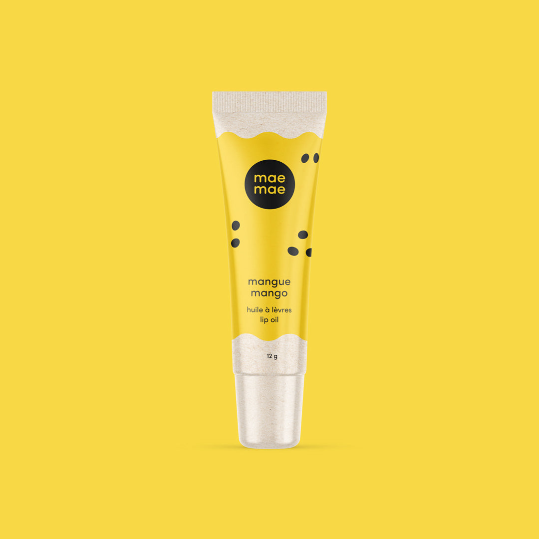 Yellow lip oil tube with 'mae ma' branding on a yellow background