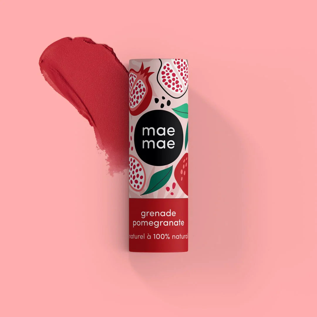 Mae Mae pomegranate lip balm on a pink background