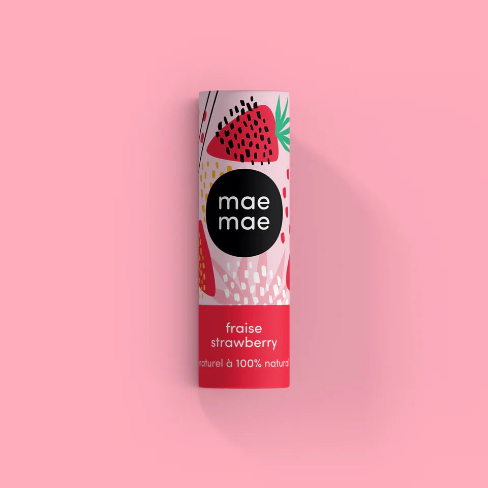 Tube of 'mae mae' strawberry-flavored product on a pink background