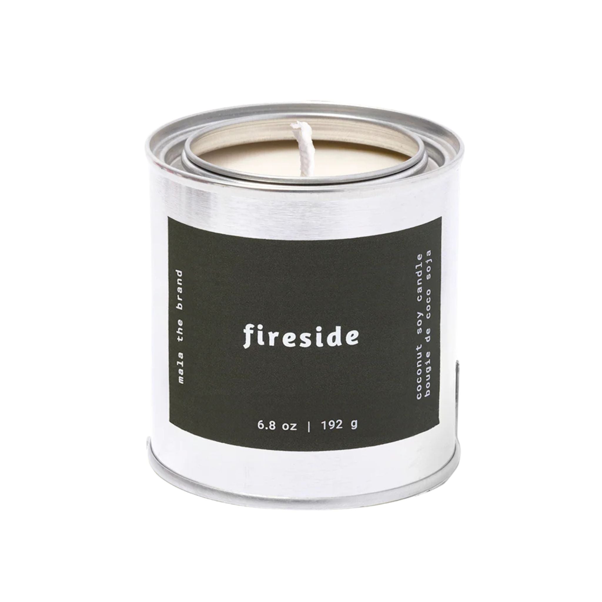 Candle in a metal canister labeled 'fireside' on a white background