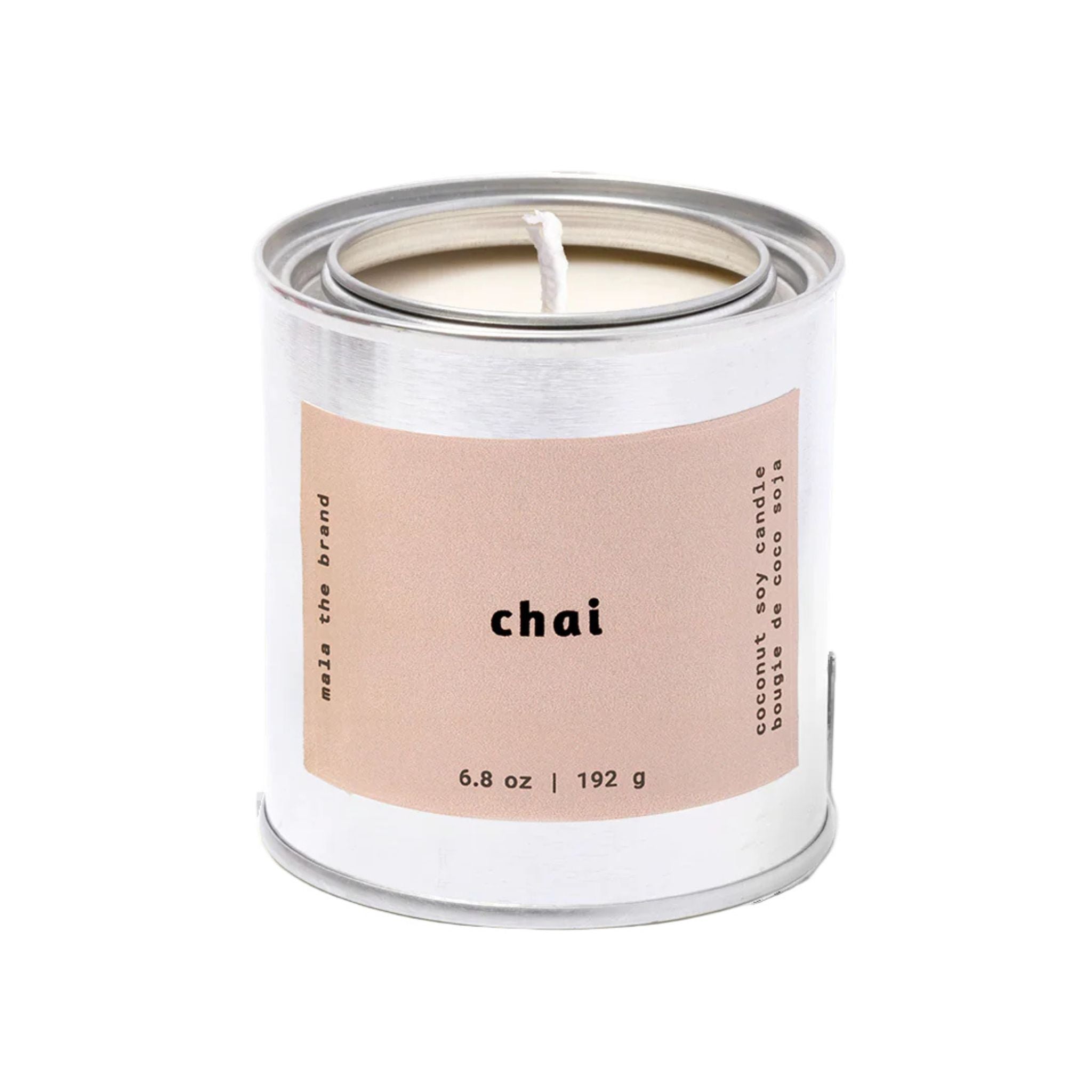 Candle in a metal can with 'chai' label on a white background