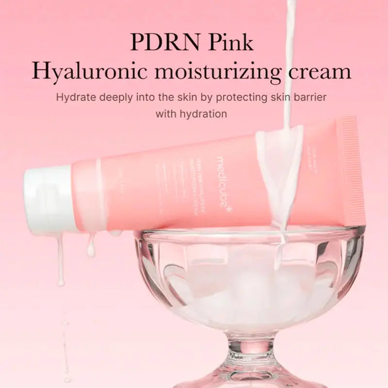 Pink hyaluronic moisturizing cream being poured into a glass container with PDRN branding.